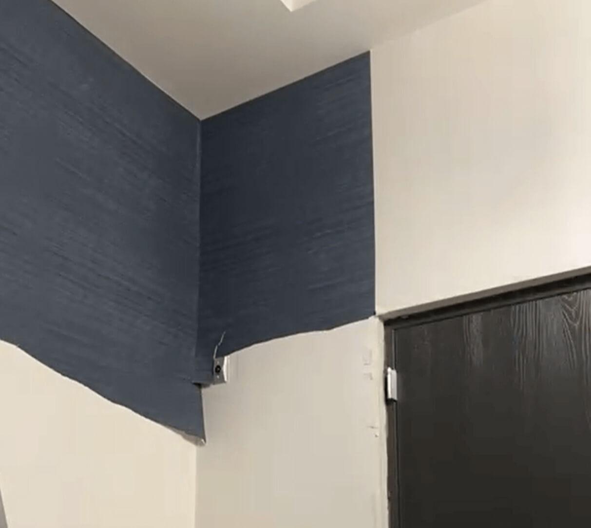 Half-removed wallpaper from wall.